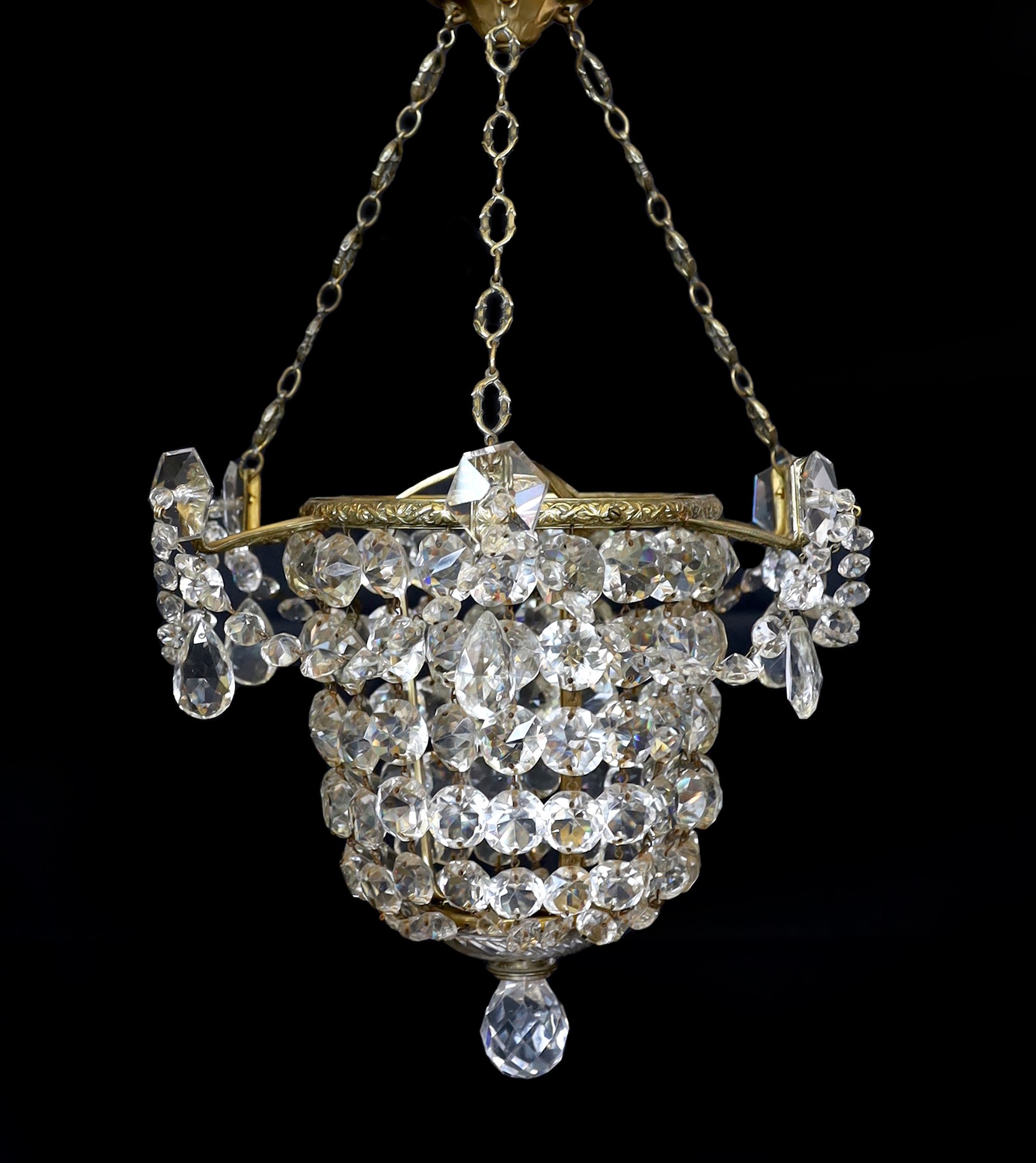 A 1930s lead crystal and brass bag shaped light fitting, height 53cm. width 36cm